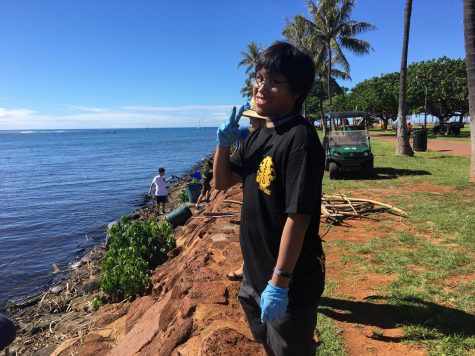 Jason Yadao, the adviser for LEO Club, supervised his students at a beach clean up at Ala Moana Beach Park.