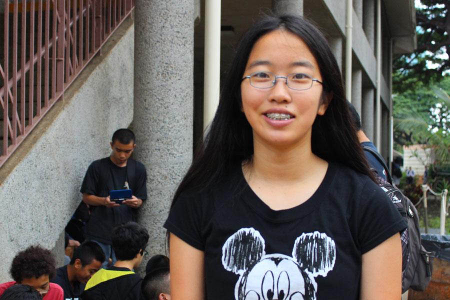 Freshman Mikaela Rivera stands near the library with her Mickey Mouse shirt.