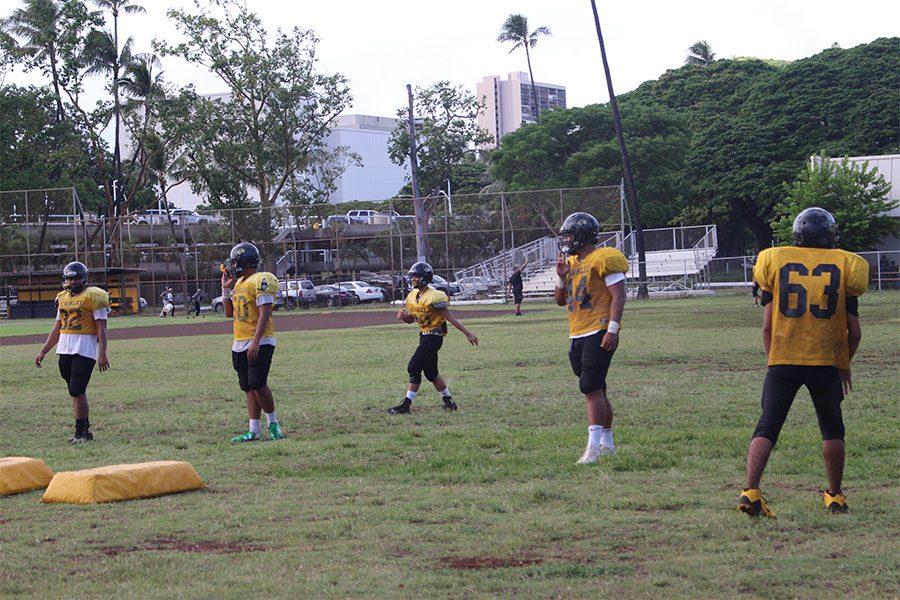 JV football team practices for the Waipahu game. The Tigers lost 43-6. Alexandria Buchanan threw the ball to Keanu Pimental and he bombed the ball to Sinapati Pita and they got the touchdown. 