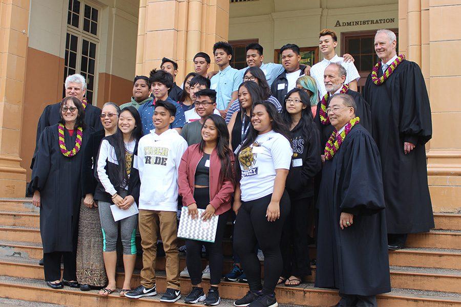 Supreme Court Justices  take a group photo with MHS students.