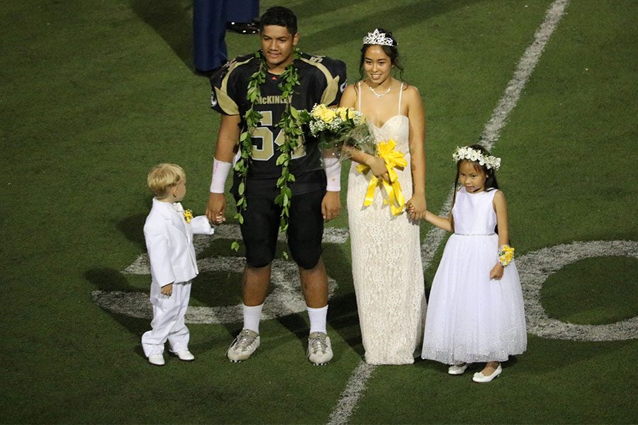 Homecoming King and Queen with the crown barer and flower girl.