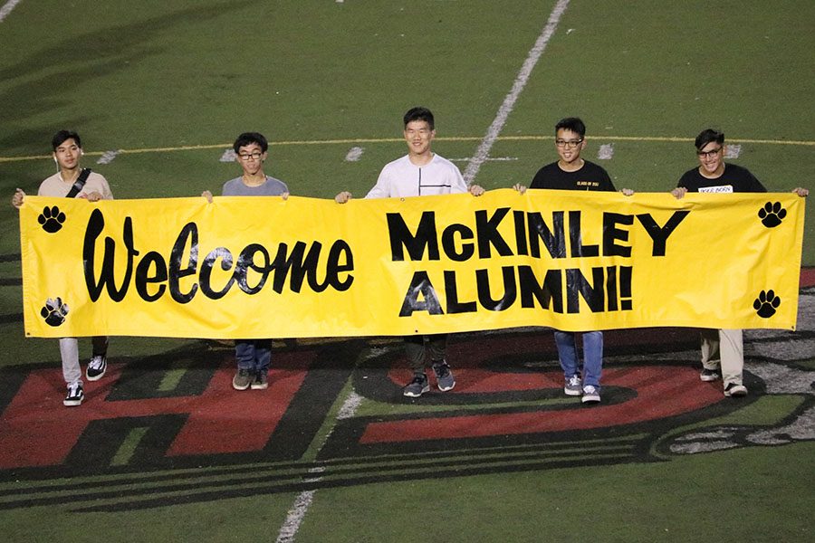 Alumni from previous graduating classes welcome the other MHS alumni that were present at the game.