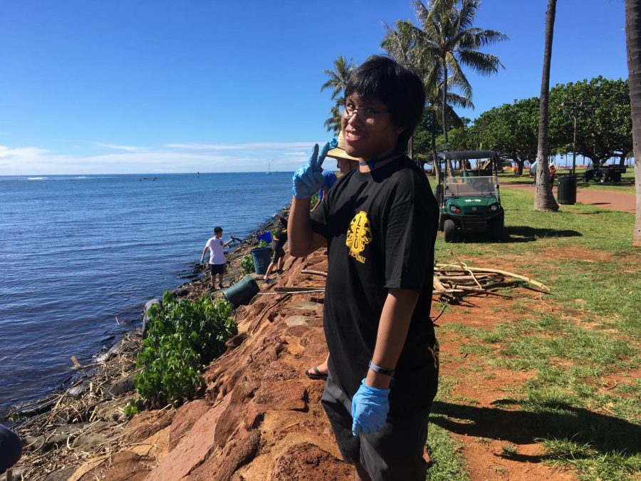 Jason Yadao, the adviser for LEO Club, supervised his students at a beach clean up at Ala Moana Beach Park. 