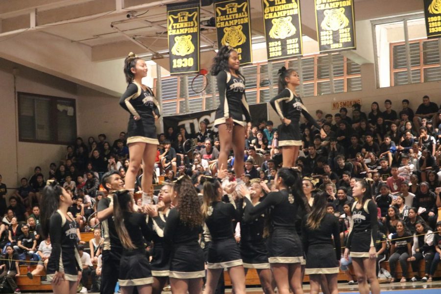 The cheerleaders performed a breathtaking performance that pumped up the whole school. 