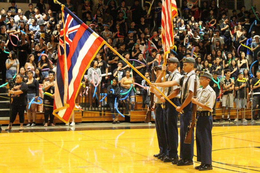 The JROTC Color Guard held the American and Hawaiian flags while the anthems were sung by the school.