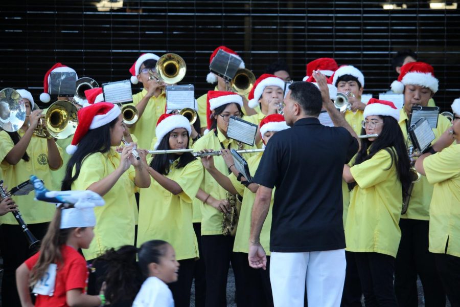 The McKinley band played football music at Make-A-Wish Foundations 7th annual Jingle Rock Run.