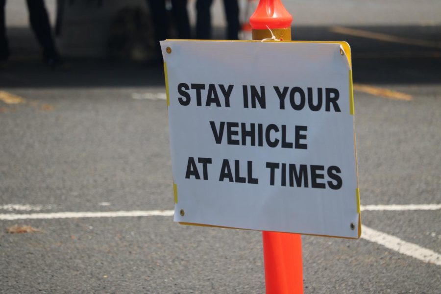 This sign reminds guests of the rules. Guest could only leave the vehicle for a group photo after the graduate crossed the oval.