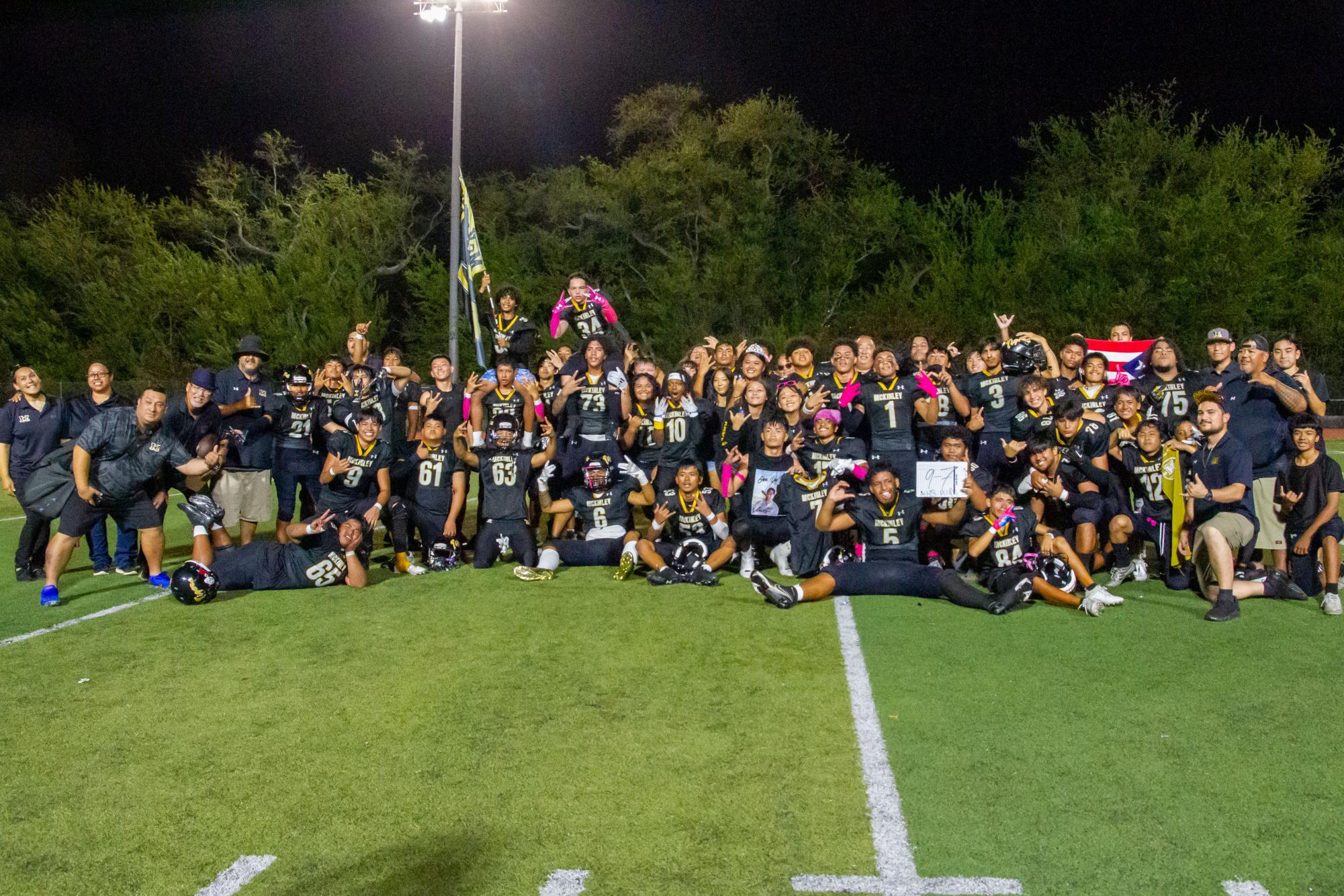 McKinley football team and staff celebrate their first victory in five years with a triumphant group photo.
