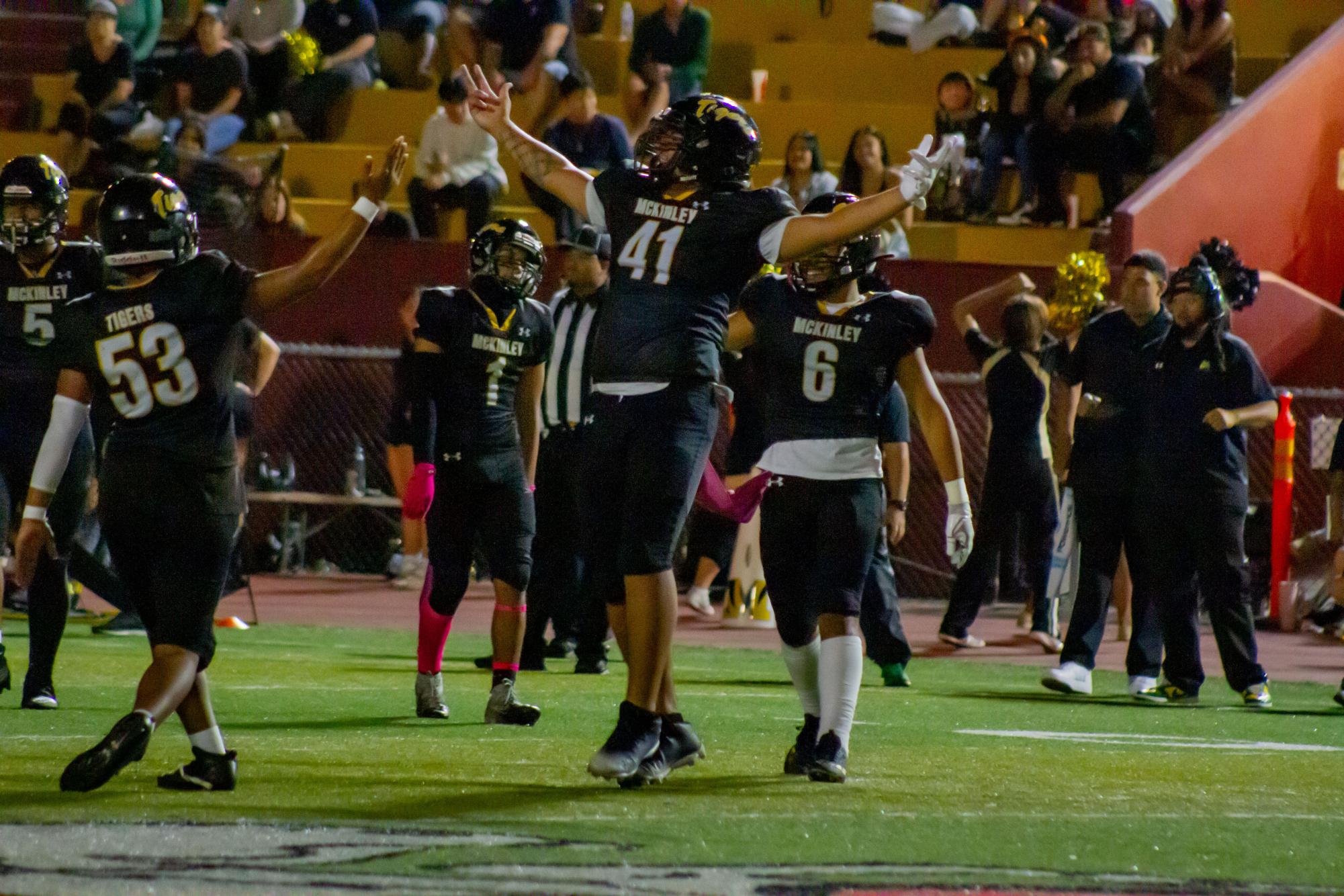 Defensive lineman Chenzen Etuale (41) celebrates McKinley’s first goal after kicker and wide receiver Gregory Givens’ 31-yard kick.
