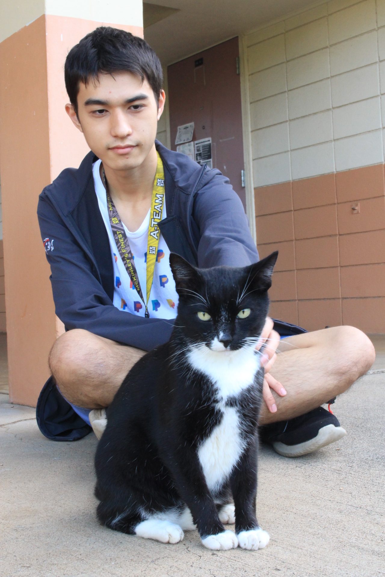 Chase Chan (c/o 2025) with Sushi on the steps of MS building. Chan always comes in the morning to feed and hangout with Sushi.
Photo by Cheska Orias.