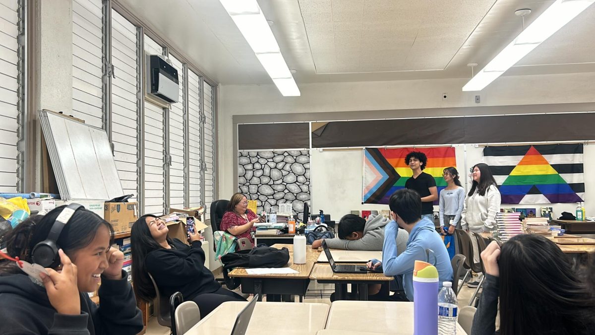 Shai Simbahon (c/o 2025), Dannah Rafaelle (c/o 2025), and Amber Suh (c/o 2026) sings to a student in Ms. Evon Le’s class. 