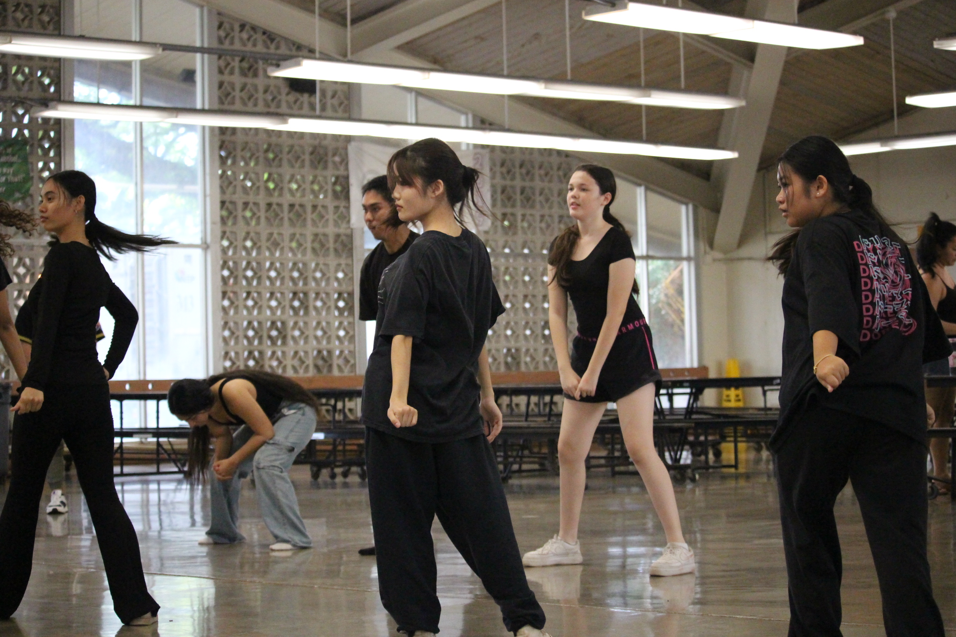 GWK Hooligans warm up and practice after school inside the cafeteria.