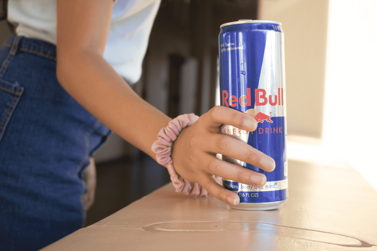 Loraine Tambalo reaching out for a can of
Red Bull containing 151 mg of caffeine.