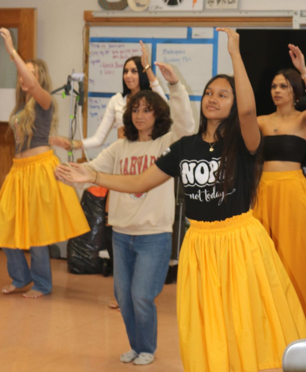 Girls’ May Day court practice their group hula. Photo by Kena Anien (c/o ‘27).