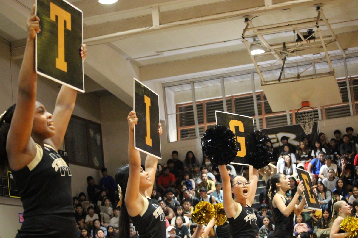 McKinley's cheerleading team gets the crowd cheering and pumped up with there performance of 'Let's Go Tigers!"
Photo by Cheska Orias.
