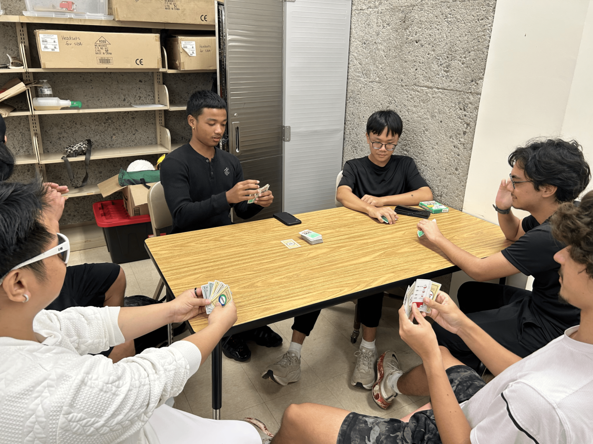 McKinley teachers and students play Monopoly in room T-1 after school as part of one of the activities YMCA provides. From left to right: Francis Philip Vilar, Michael Vasconcellos (c/o '28), Baixuan Hu (c/o '28), Micah James Quimpo (c/o '26), Yeudi Gutierrez (c/o '26). 