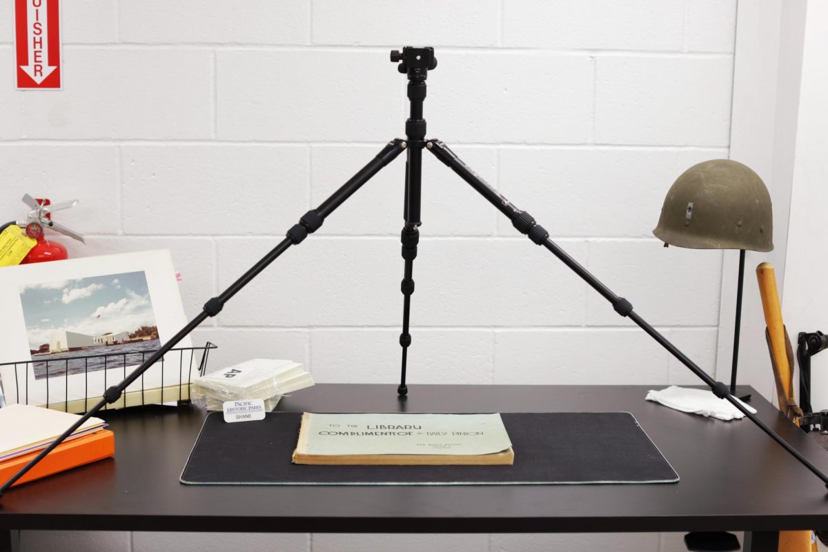 Kaneshiro’s digitizing setup consists of a tripod and a camera, looking over the archives. For the best quality scan, it must be laid flat. 
